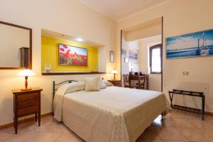 Postel nebo postele na pokoji v ubytování B&B Hibiscus