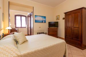 Postel nebo postele na pokoji v ubytování B&B Hibiscus