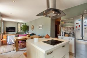 a kitchen with a table and a stove top oven at Casa Marina in Bastia