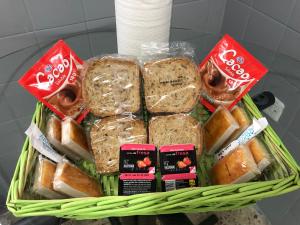 a basket filled with sandwiches and other food items at O Son do Avia in Ribadavia