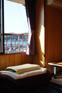 Postel nebo postele na pokoji v ubytování Guesthouse SETOUCHI LIFE