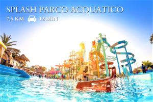 a water park in a resort with a water slide at Coral - 30 passi dalla Spiaggia della Purità in Gallipoli