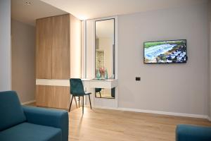 TV a/nebo společenská místnost v ubytování Hotel Vino