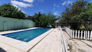 a swimming pool in a backyard with a fence at Family holiday home. in Qusar