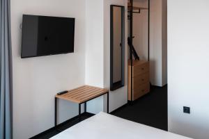 TV a/nebo společenská místnost v ubytování Hotel Campus 90 - Free Parking