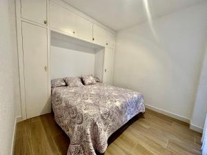 Rúm í herbergi á Apartamento Rancho Suizo