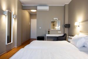 Cama ou camas em um quarto em Abc Hotel
