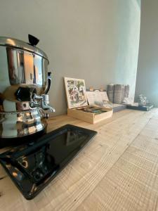 a coffee machine sitting on the floor in a room at Rutzer Hotel Ristorante & Panoramic SPA in Asiago +45 photos