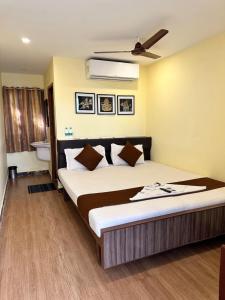 Letto o letti in una camera di Hotel Ramakrishna