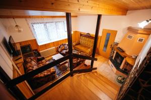 an overhead view of a living room with a couch at YURA vila Čeladná - ZDARMA SAUNA A VNITŘNÍ BAZÉN V YURA HOTELU in Čeladná