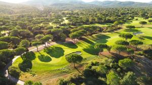 an aerial view of a golf course with trees at Les ailes d'un reve in Vidauban