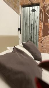 Postel nebo postele na pokoji v ubytování Hotel Felice