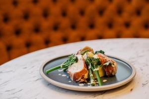 a plate of food on a table at San Clu Hotel, Bar & Brasserie in Ramsgate