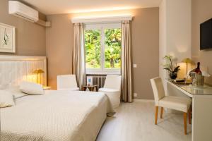 Rúm í herbergi á Hotel Ascona
