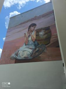 een schilderij van een vrouw op een muur bij Niedziałkowskiego Radom in Radom