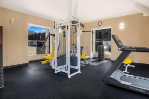 a gym with tread machines and a treadmill at SureStay Plus Hotel by Best Western Upland - Ontario North in Upland
