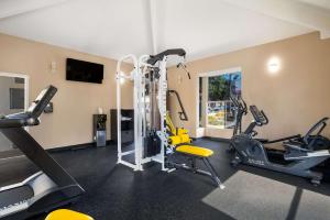 a gym with treadmills and elliptical machines at SureStay Plus Hotel by Best Western Upland - Ontario North in Upland