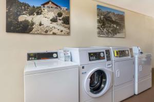two washing machines and a washer and dryer in a room at SureStay Plus Hotel by Best Western Upland - Ontario North in Upland