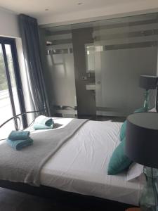 Llit o llits en una habitació de Villa Larosa with seaview in Es Cubells Ibiza
