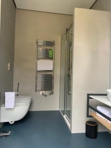 a bathroom with a tub and a toilet and a shower at Donna Caterina in Monopoli