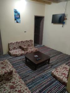 a living room with a couch and a coffee table at Abu Salem Garden- كرم ابو سالم in Saint Catherine