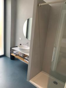 a bathroom with a sink and a mirror at Donna Caterina in Monopoli