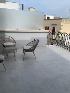 two chairs sitting on top of a roof at Donna Caterina in Monopoli