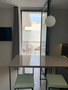 a dining room with a table and two chairs at Donna Caterina in Monopoli