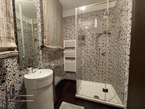 a bathroom with a toilet and a shower and a sink at Villa I tre Cipressi in Lido di Camaiore +22 photos