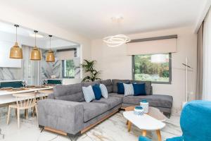 a living room with a couch and a table at Pachis Escape Suites in Pachis