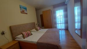 Postel nebo postele na pokoji v ubytování Guest house Tom
