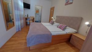 Postel nebo postele na pokoji v ubytování Guest house Tom