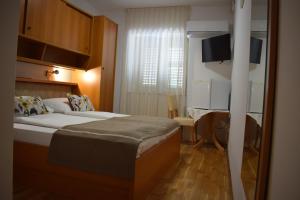 Postel nebo postele na pokoji v ubytování Guest house Tom