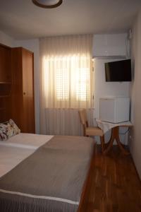 Postel nebo postele na pokoji v ubytování Guest house Tom