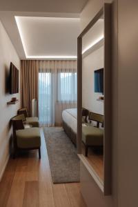Postel nebo postele na pokoji v ubytování Boutique Hotel Panorama + 37 fotografií