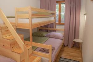Postel nebo postele na pokoji v ubytování Apartments Pikon