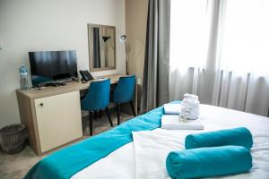 Posteľ alebo postele v izbe v ubytovaní Garni Hotel IMPERIUM Subotica