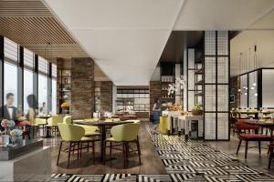 a rendering of a restaurant with tables and chairs at Four Points by Sheraton Chengdu Tianfu New Area in Chengdu