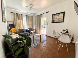 a living room with a couch and a table at The White House in Hartbeespoort