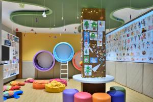 a childrens play room with colorful furniture and a ladder at Sheraton Kosgoda Turtle Beach Resort in Bentota
