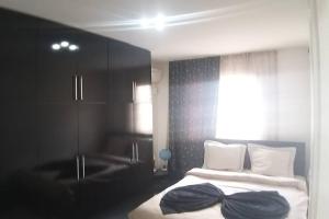 Cama ou camas em um quarto em Smf Suites 2+1 15