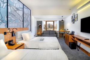 Postel nebo postele na pokoji v ubytování Le Meridien Abu Dhabi