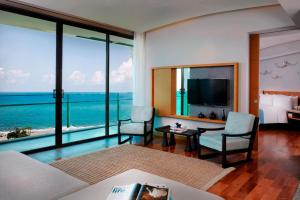 a hotel room with a view of the ocean at Rayong Marriott Resort & Spa in Klaeng