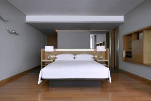 Rayong Marriott Resort & Spa客房内的一张或多张床位