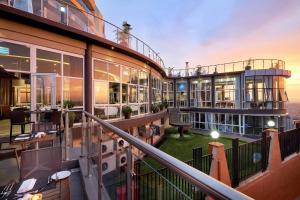 an aerial view of a building with a balcony at Protea Hotel by Marriott Kampala Skyz in Kampala