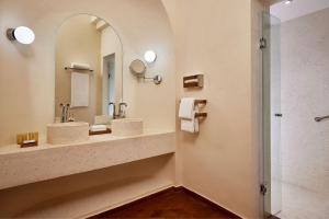 a bathroom with two sinks and a mirror at Sheraton Miramar Resort El Gouna in Hurghada