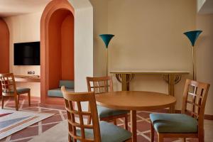a dining room with a table and chairs at Sheraton Miramar Resort El Gouna in Hurghada