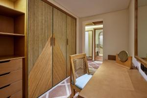 a dining room with a table and a chair at Sheraton Miramar Resort El Gouna in Hurghada