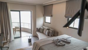 Postel nebo postele na pokoji v ubytování Alissachni SeaSide Hotel
