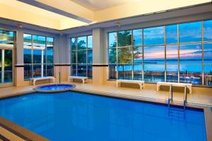 a pool in a hotel room with a view of the ocean at Sheraton Erie Bayfront Hotel in Erie